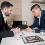A man is getting investment advice from a specialist